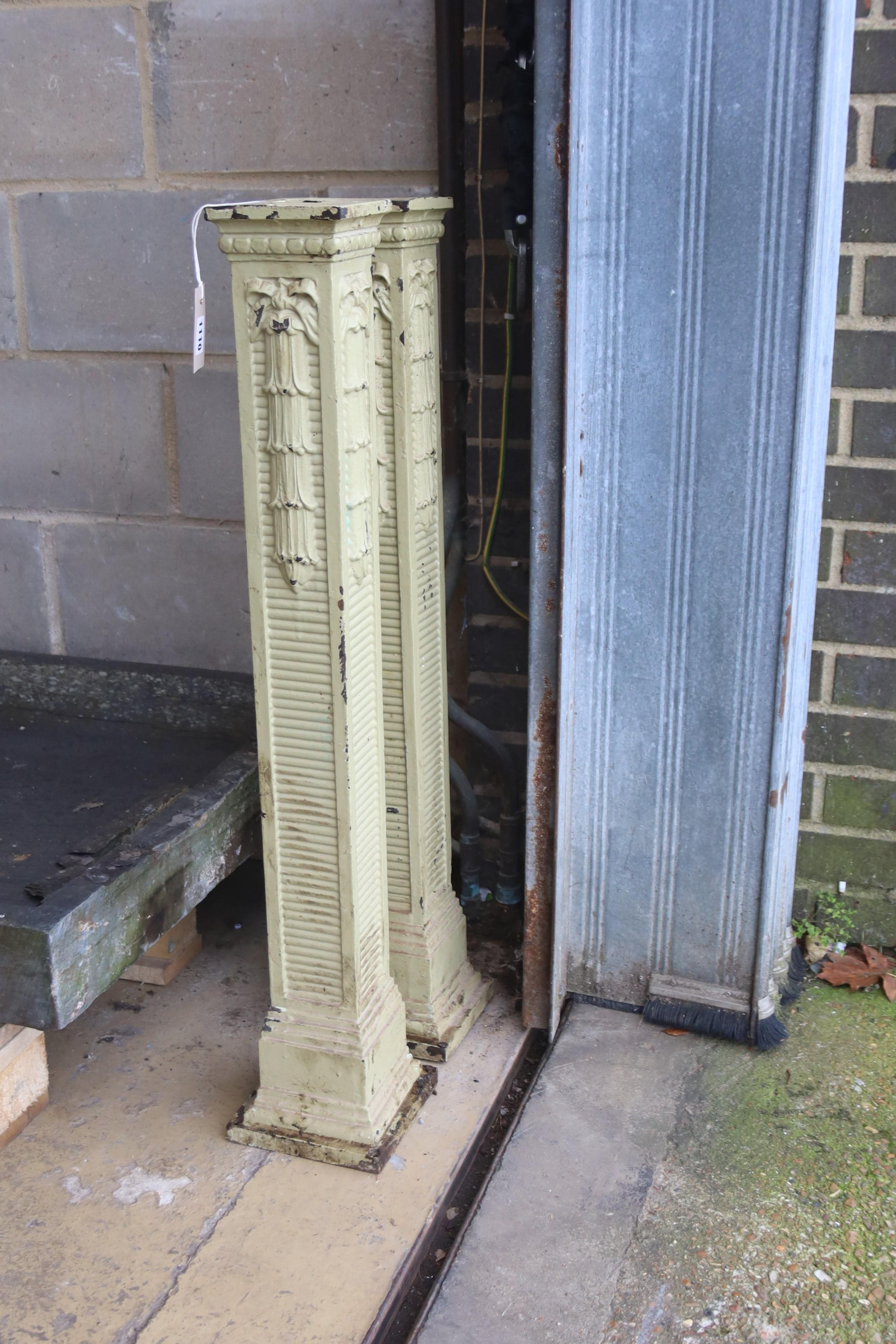 A pair of painted cast iron columns, height 90cm